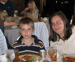 Boy and mother at dinner table