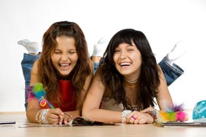 two girls laughing.  © Qwasyx | Dreamstime.com 